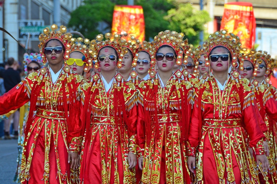 caption: The Seattle Chinese Girls Drill Team at the Chinatown Parade in 2011. 