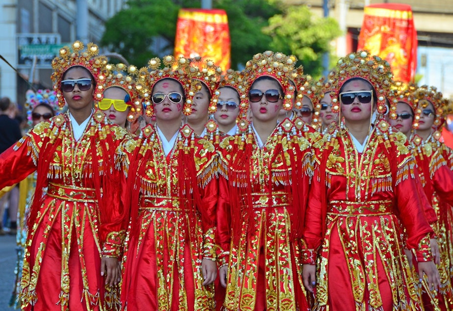 caption: The Seattle Chinese Girls Drill Team at the Chinatown Parade in 2011. 