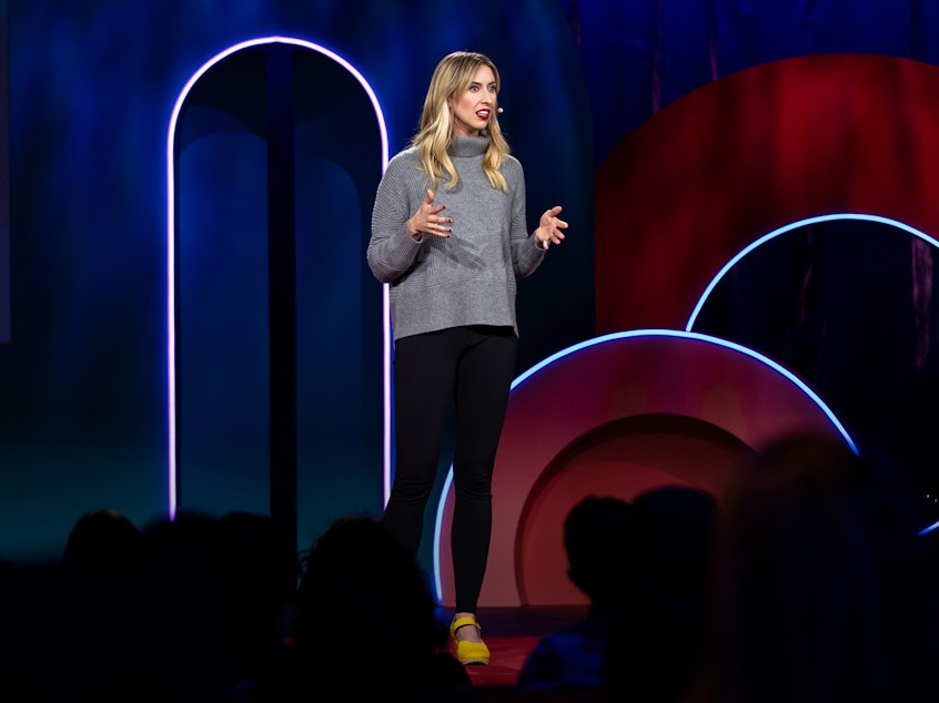 caption: Nora McInerny on the TED stage.