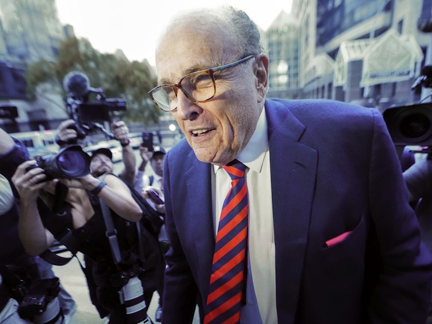 caption: Rudy Giuliani arrives at the Fulton County Courthouse in Atlanta on Aug. 17, 2022.