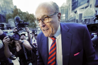 caption: Rudy Giuliani arrives at the Fulton County Courthouse in Atlanta on Aug. 17, 2022.