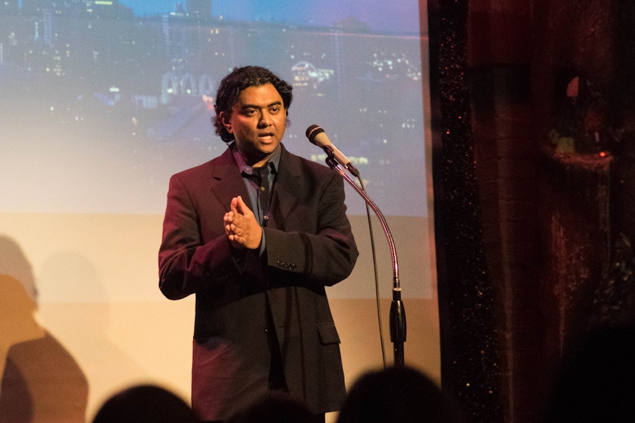 caption: Seattle writer Michael Perera tells his story at a "Why We Stayed Here" event at Theatre Off Jackson on January 17, 2018.