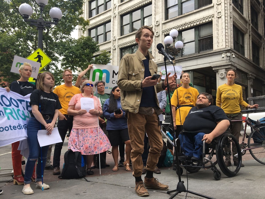 caption: At a press conference in Pioneer Square on Friday, Sam Lockhart of Seattle said he's witnessed two fatal accidents involving bicyclists and been in three bicycle accidents himself.