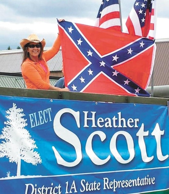 caption: Idaho Rep. Heather Scott sparked controversy in 2015 when she posed with a Confederate flag on her campaign float at Priest River, Idaho's Timber Days parade.