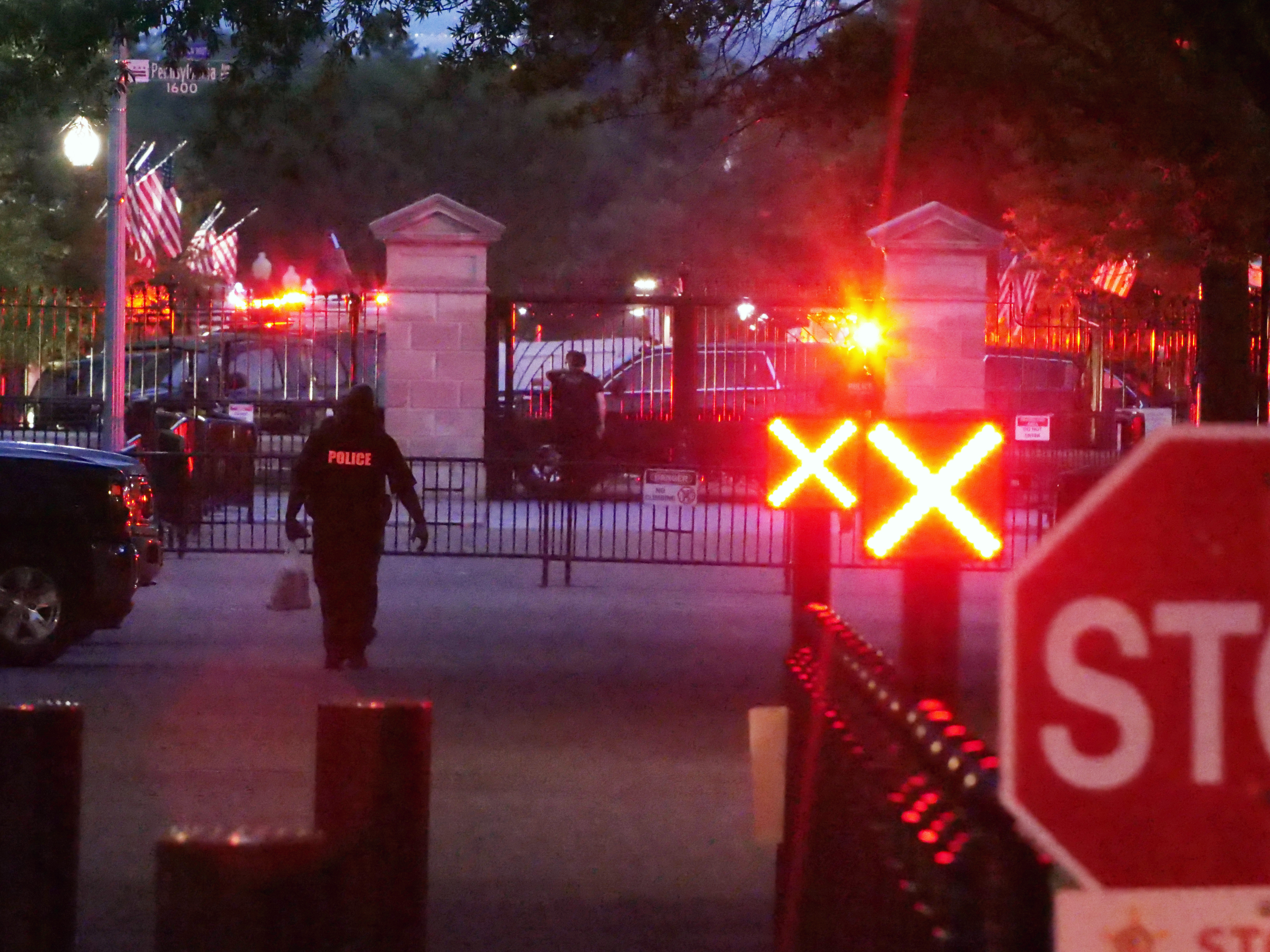 caption: Police are seen outside the White House grounds, Sunday night, July 2, 2023 in Washington.