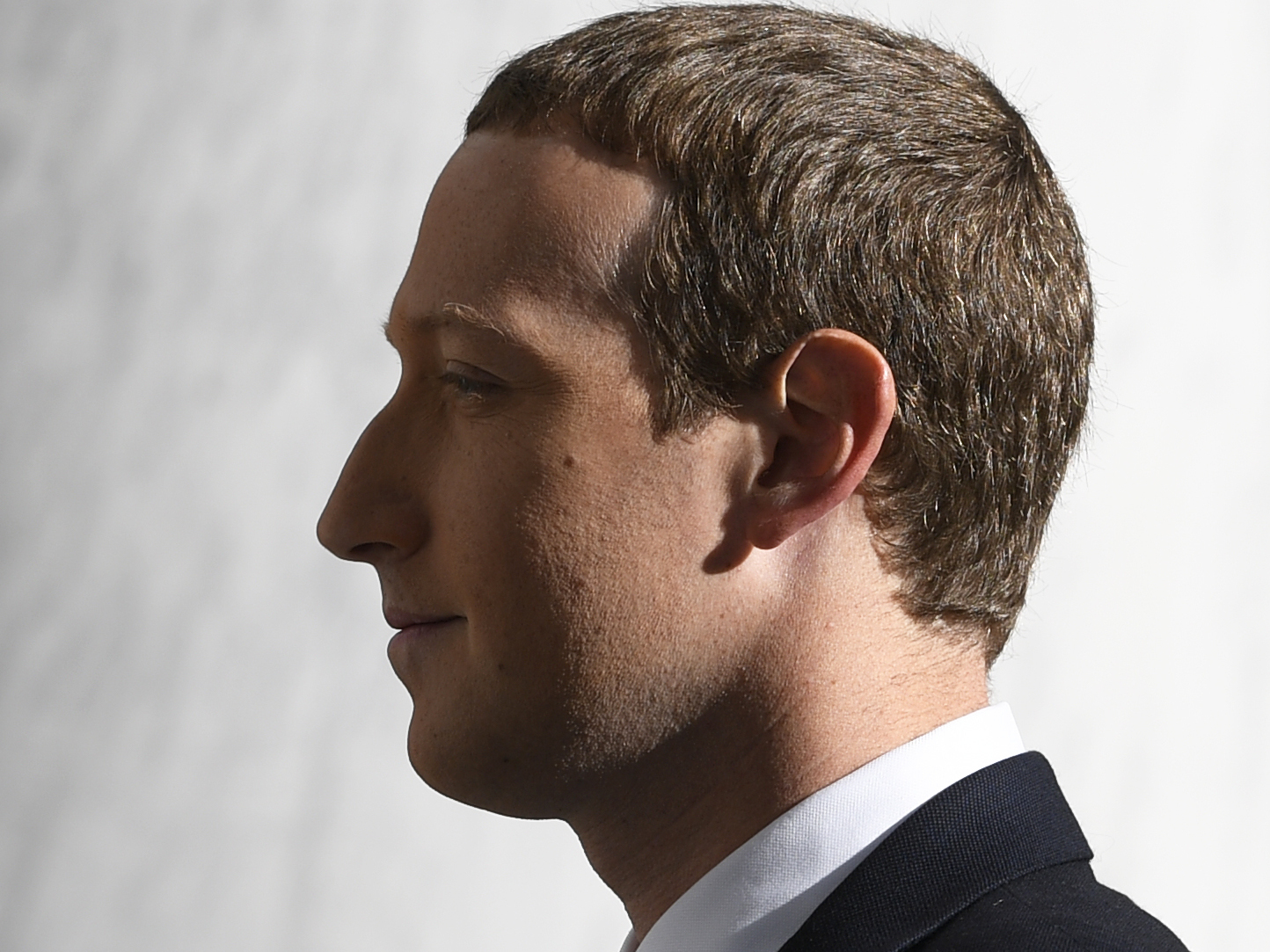 caption: Facebook Chief Executive Officer Mark Zuckerberg arrives for a hearing before the House Financial Services Committee on Capitol Hill in October 2019.