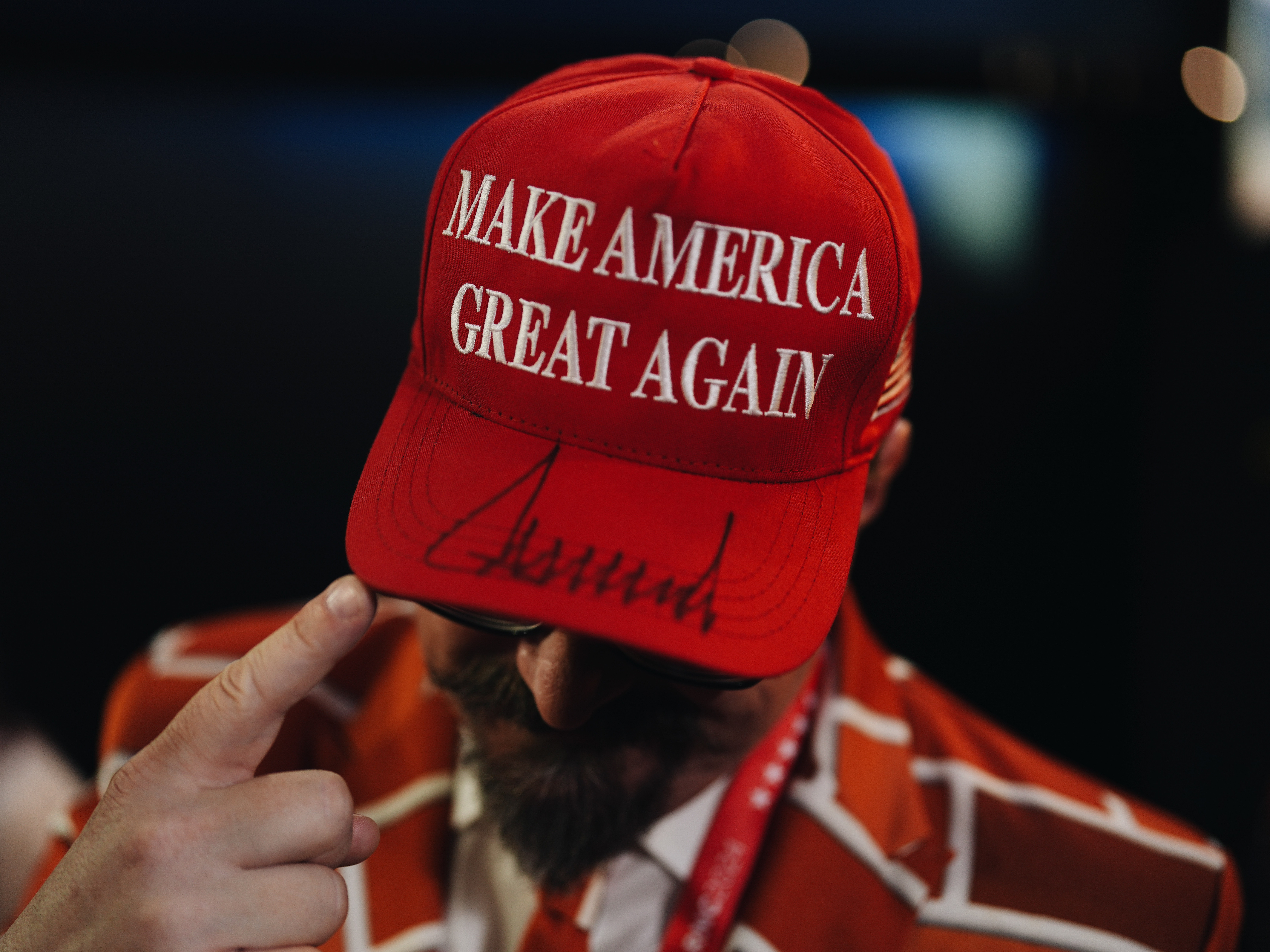 caption: Blake Marnell, delegate from California, shows us his Make America Great Again hat signed by Donald Trump on the third day of the Republican National Convention.