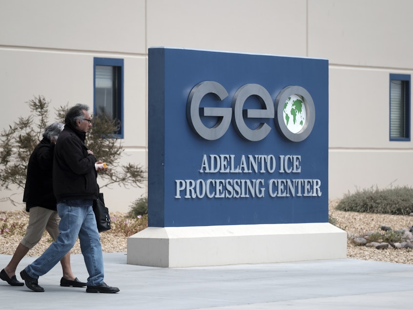 caption: The U.S. Immigration and Enforcement processing center in Adelanto, Calif., is one of the detention facilities operated by GEO Group Inc.