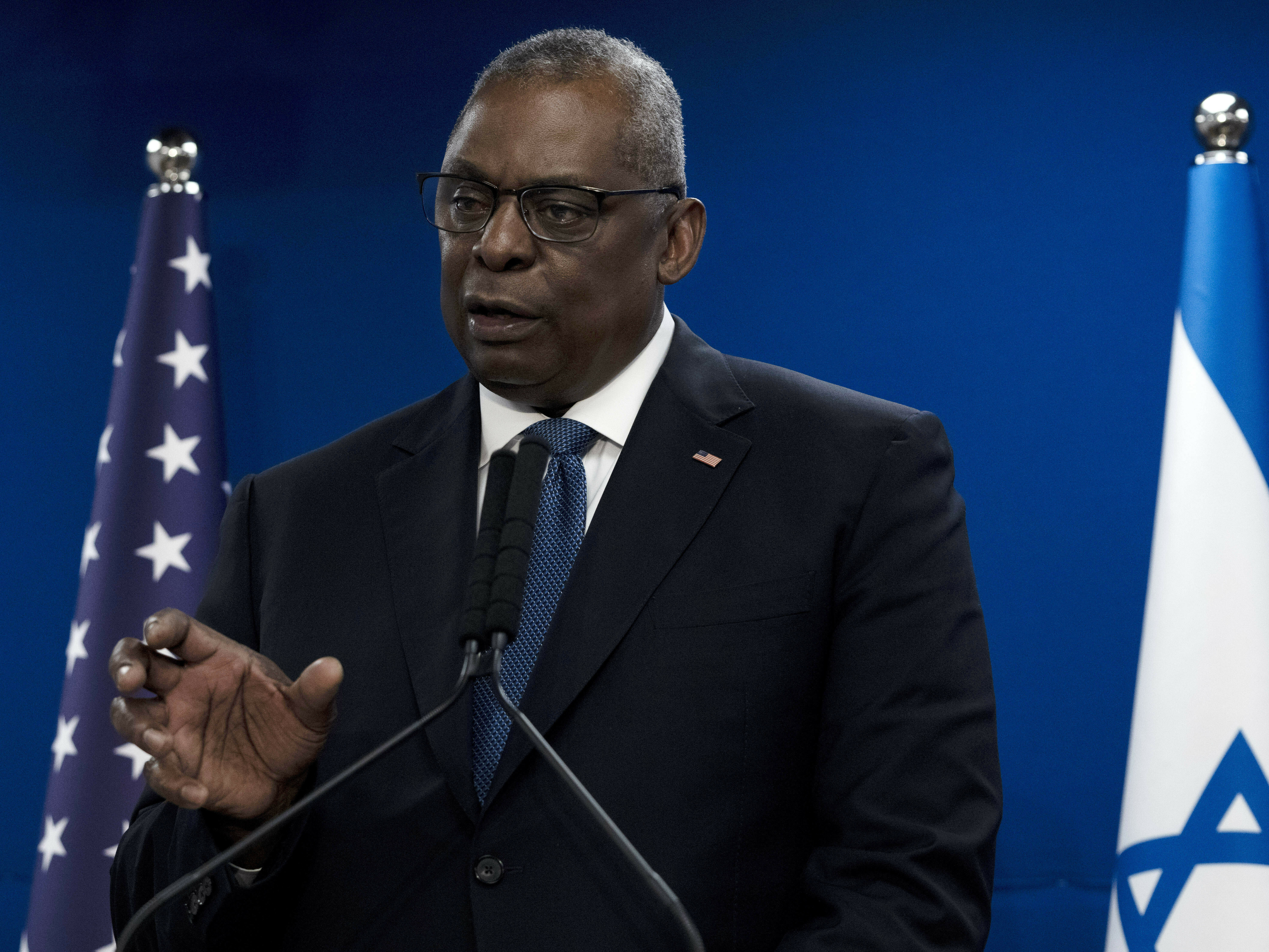caption: U.S. Secretary of Defense Lloyd Austin makes a joint statement with Israel Minister of Defense Yoav Gallant, after their meeting about Israel's military operation in Gaza, in Tel Aviv, Israel, Monday, Dec. 18, 2023.