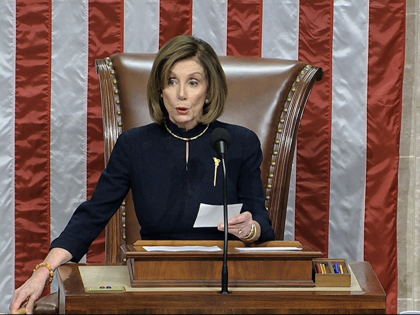 caption: House Speaker Nancy Pelosi, D-Calif., announces the passage of the first article of impeachment, abuse of power, against President Trump by the House of Representatives on Wednesday.