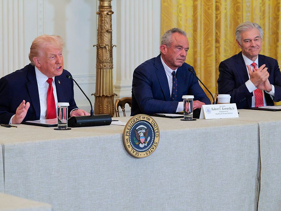 caption: U.S. President Donald Trump speaks as U.S. Secretary of Health and Human Services Robert F. Kennedy Jr. and Administrator for the Centers for Medicare &amp; Medicaid Services Mehmet Oz look on during a rural health roundtable on January 16, 2026 in Washington, DC.