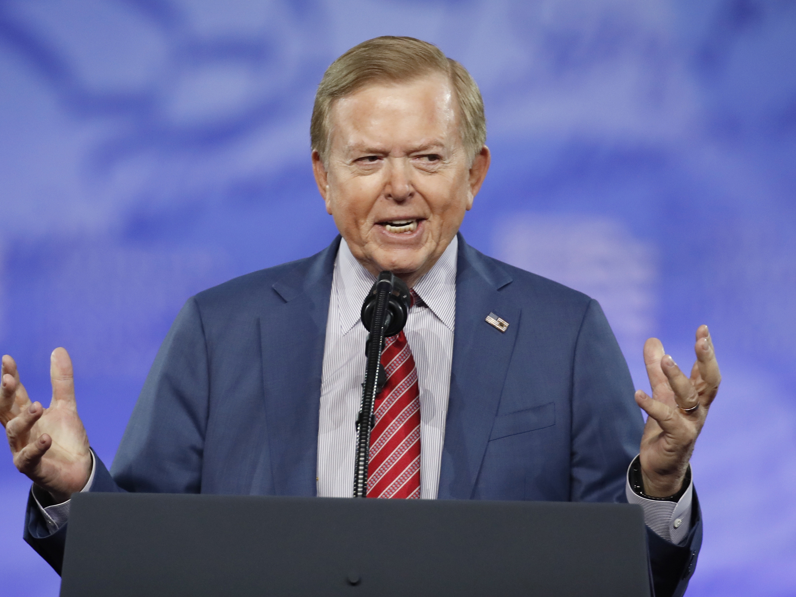 caption: FILE - Fox Business News host Lou Dobbs speaks at the Conservative Political Action Conference (CPAC), on Feb. 24, 2017, in Oxon Hill, Md. 