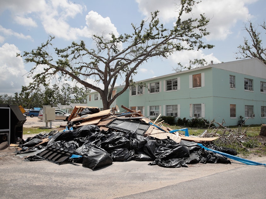 caption: Debris is piled on May 10 outside an apartment complex that was damaged by Hurricane Michael in Panama City, Fla. Rep. Chip Roy objected to a procedural vote on a bipartisan $19.1 billion disaster aid bill, forcing Congress to wait until June to finish work on the legislation.