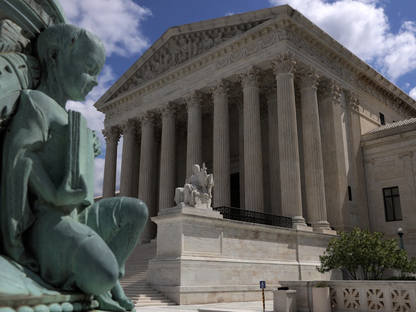 caption: The exterior of the U.S. Supreme Court pictured in Washington, DC in May 2020. Col. Gail Curley, the current court marshal, has been tasked with investigating the source of the leaked draft opinion.
