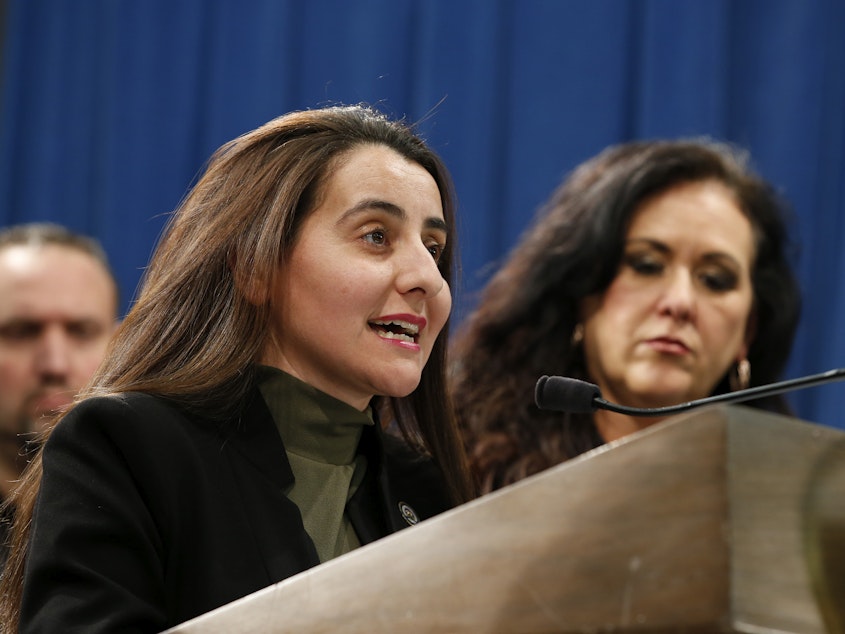 caption: California Assembly member Monique Limón (foreground) introduced a bill to create a financial watchdog agency for the state.