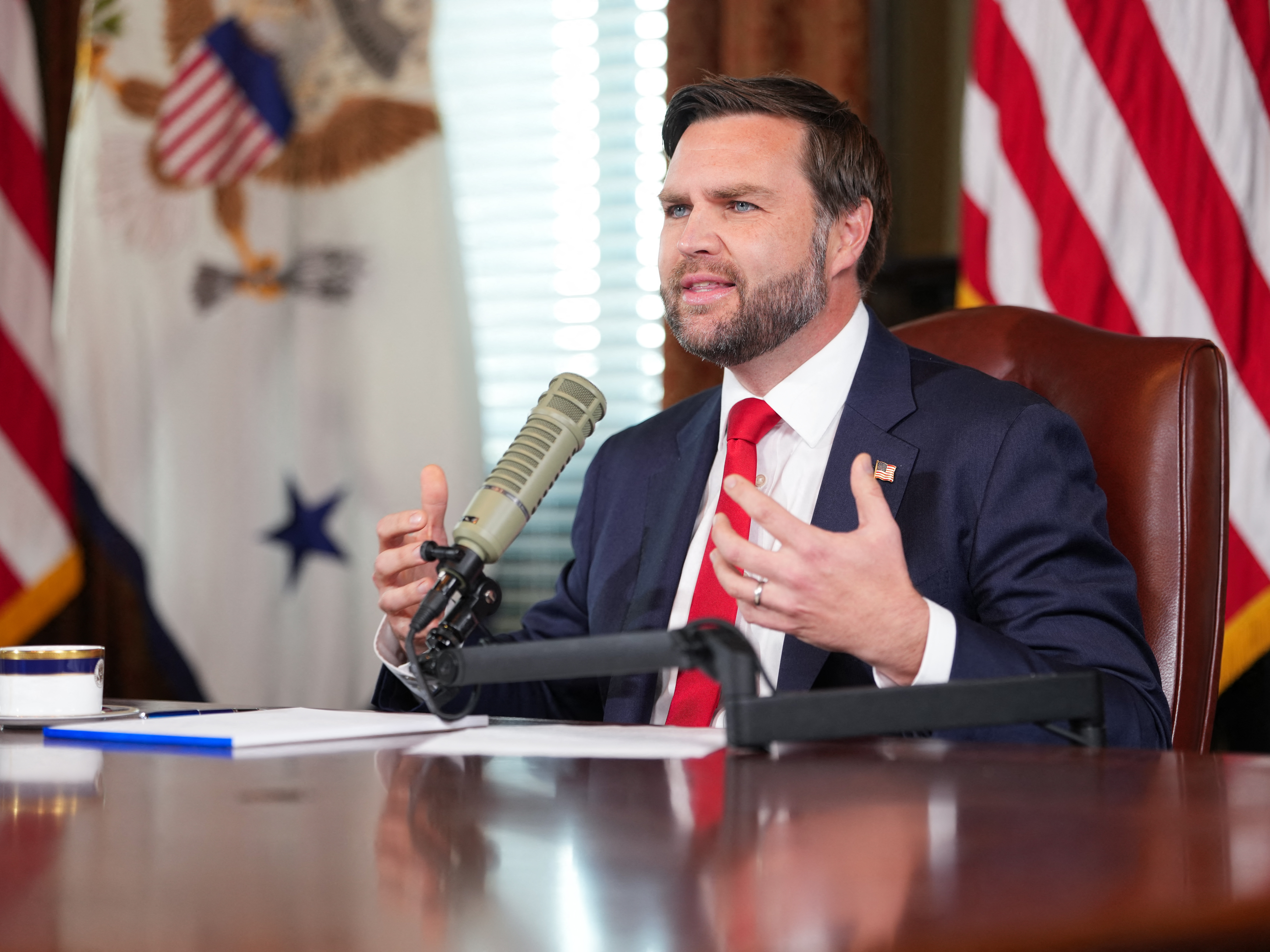 caption: Vice President JD Vance hosts an episode of the <em>Charlie Kirk Show</em> on Monday. Kirk was killed last week while speaking at Utah Valley University.