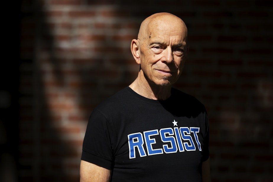 caption: David Neth, a lead organizer of Seattle's first Pride in 1974, is portrayed on Wednesday, June 5, 2024, at Occidental Park in Seattle.