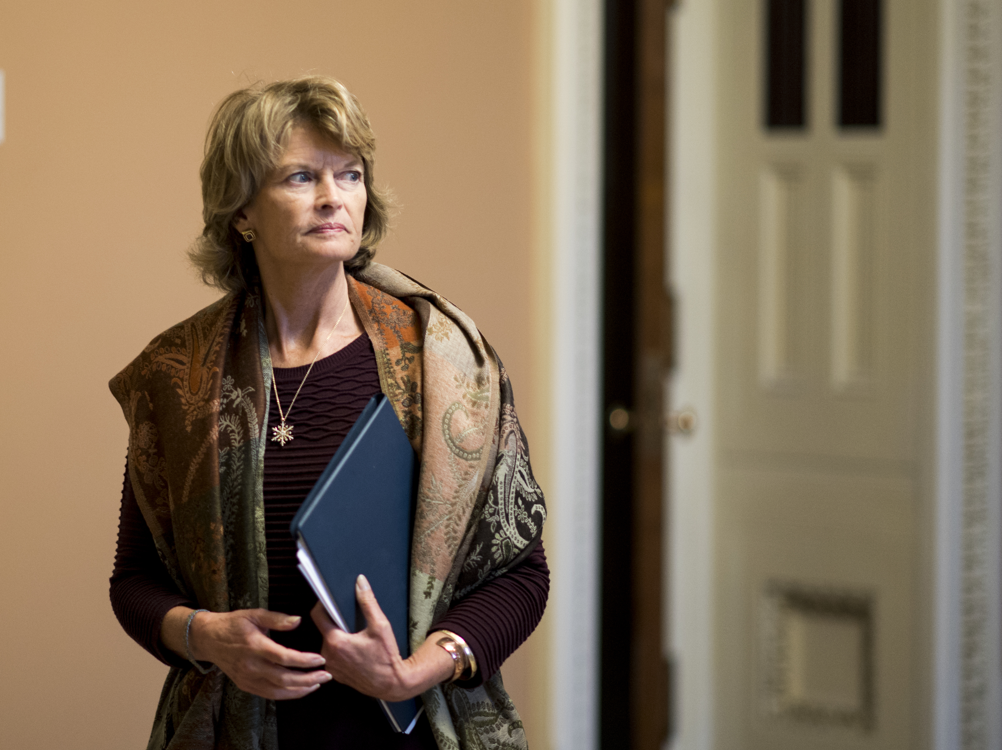 caption: Sen. Lisa Murkowski, R-Alaska, said in a television interview that she is "disturbed" by Senate Majority Leader Mitch McConnell's coordination with President Trump and his staff on an impending impeachment trial.