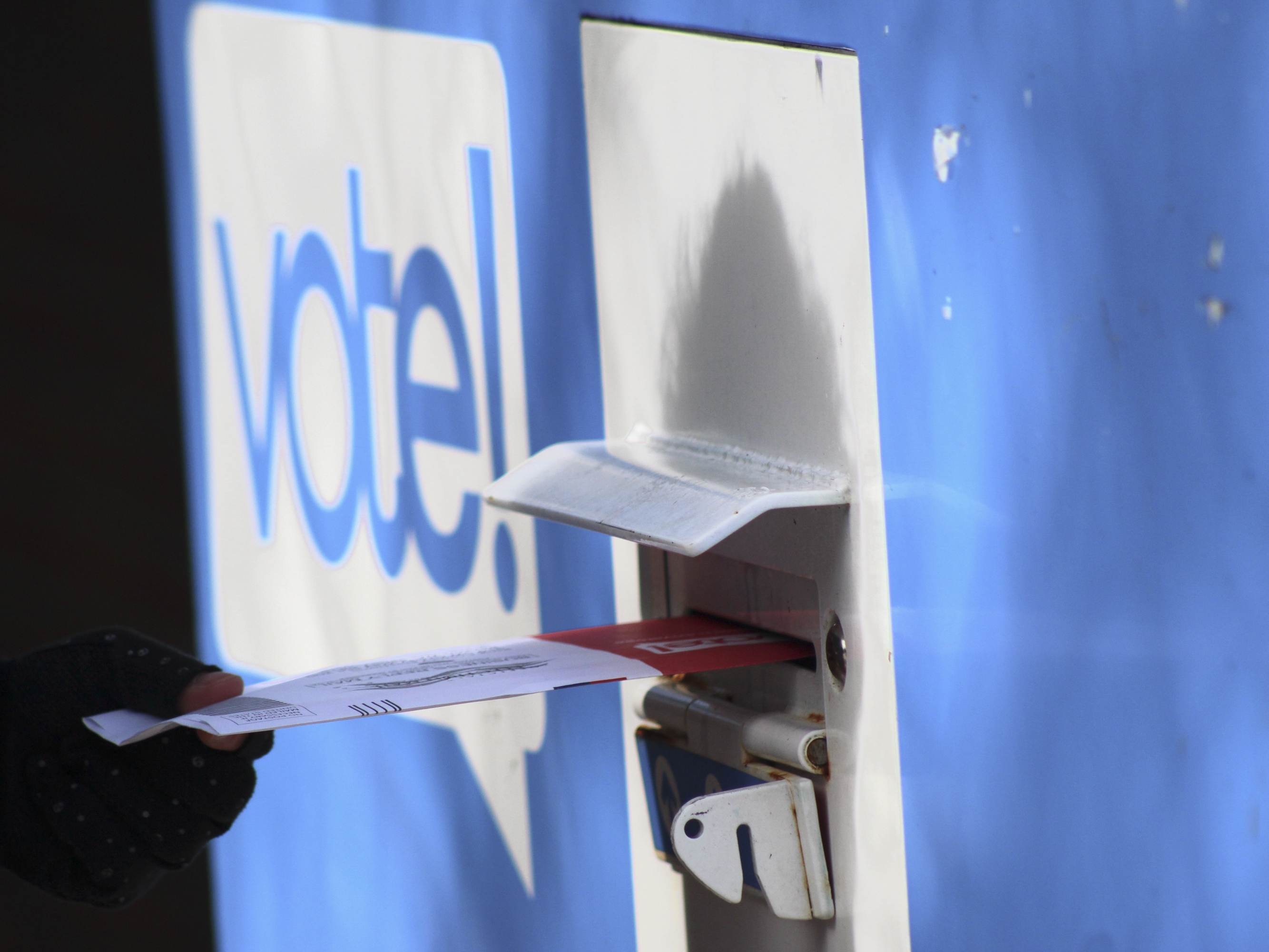 caption: In this file photo, a person drops off a ballot at a drop box during the presidential primary election on Tuesday, March 12 in Seattle. Washington state is reliably Democratic in its voting, but its late summer top-two primary has predictive power for how the nation feels about the two main political parties.