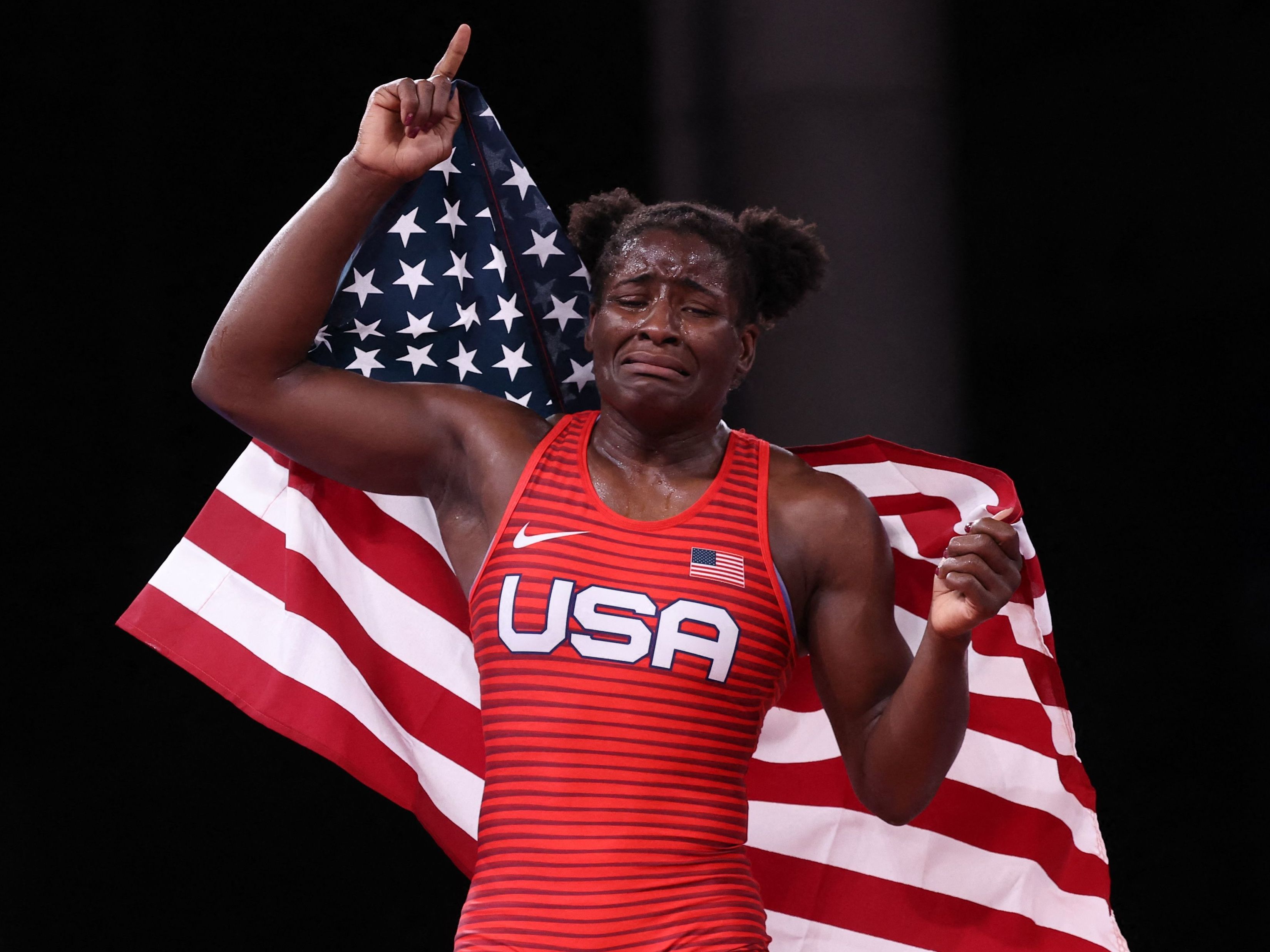caption: Mensah-Stock alternates between smiling and crying Tuesday as she celebrates a gold medal in her Olympic debut.