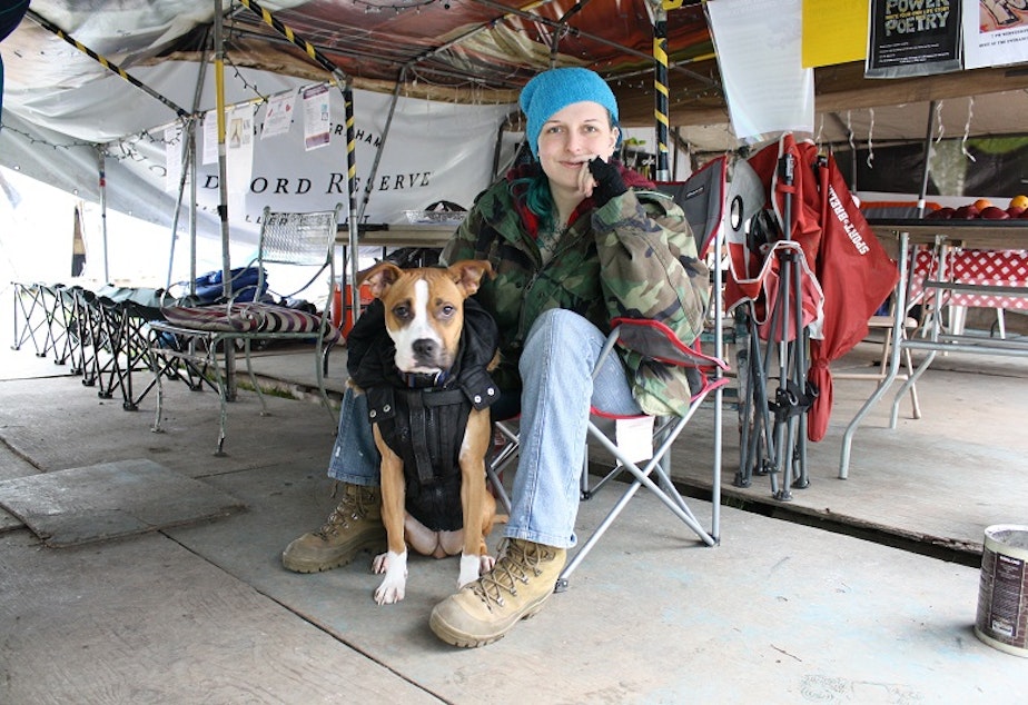 caption: Tent City 3 resident Hannah Webb hopes to get back on her feet when her tattoo equipment arrives from Missouri - and she can start working