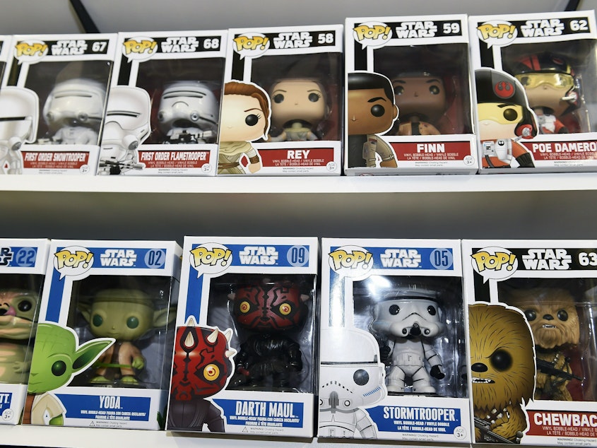 caption: Funko Pop Star Wars action figures line the shelves at Meltdown Comics and Collectibles in Los Angeles in 2015.