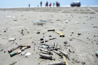 caption: In this picture taken on September 3, 2019 used medical waste is pictured on Clifton beach in Karachi. - Swarms of flies, water-borne illnesses, and rivers of sewage have brought Pakistan's Karachi to its knees this rainy season as decades of mismanagement have turned the countrys commercial capital into a post-apocalyptic wasteland.