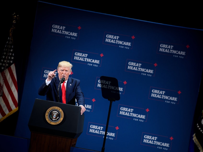 caption: President Trump talked to seniors about health care in central Florida in early October. "We eliminated Obamacare's horrible, horrible, very expensive and very unfair, unpopular individual mandate," Trump told the crowd.