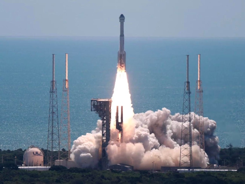 caption: Boeing's Starliner spacecraft atop a United Launch Alliance Atlas V rocket lifts off from from Cape Canaveral, Fla., flying people for the first time. The test mission is sending two astronauts to the International Space Station for a weeklong stay.