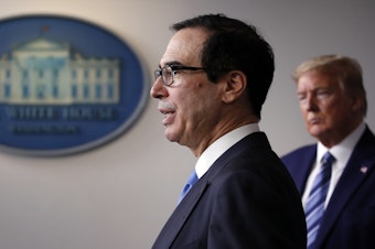 caption: Treasury Secretary Steven Mnuchin speaks at a White House coronavirus press briefing in April.