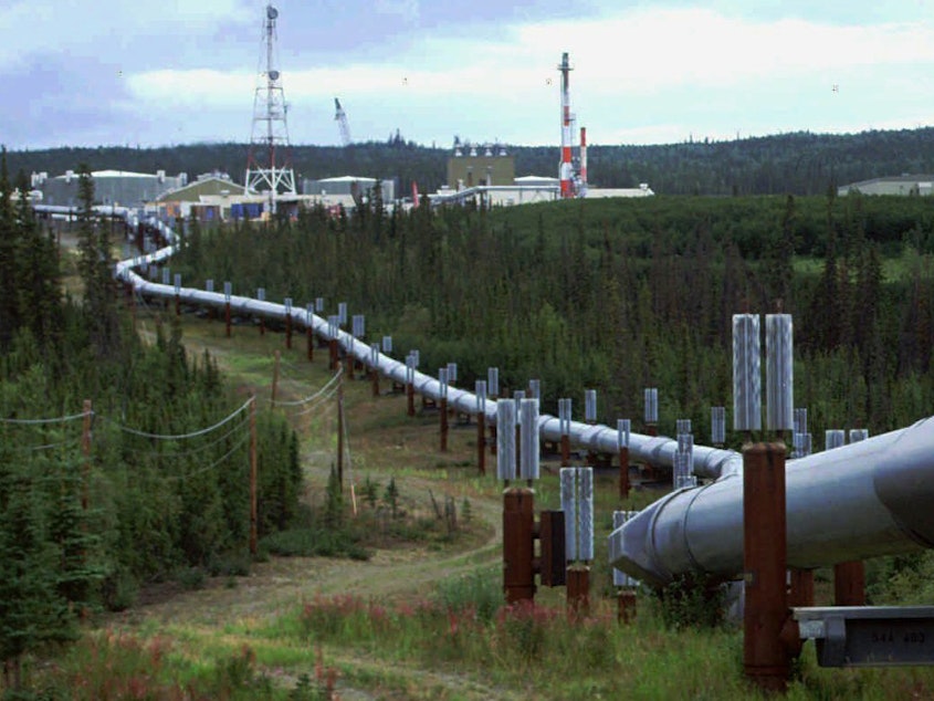 caption: The Biden administration is announcing new and proposed regulations to limit climate-warming methane emissions from oil and gas operations and pipelines. This undated file photo shows the Trans-Alaska pipeline and pump station north of Fairbanks.