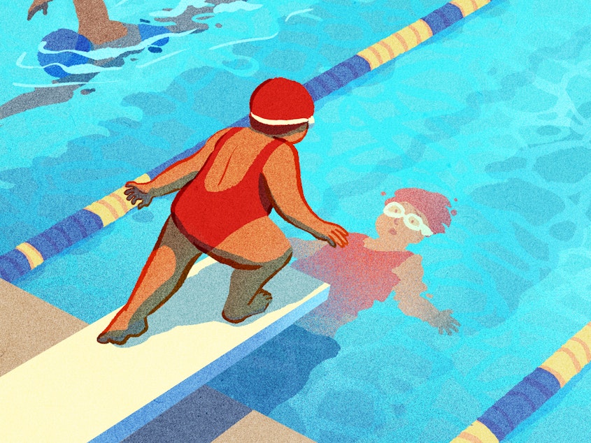A person stands on a diving board above a pool, peering anxiously into their reflection. Other people can be seen swimming off to the sides.