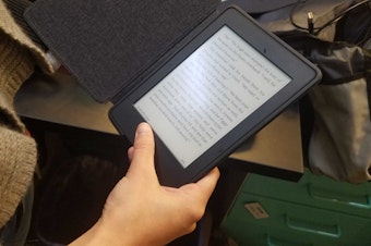 caption: An e-book reader. E-books are popular items in the King County Library System.