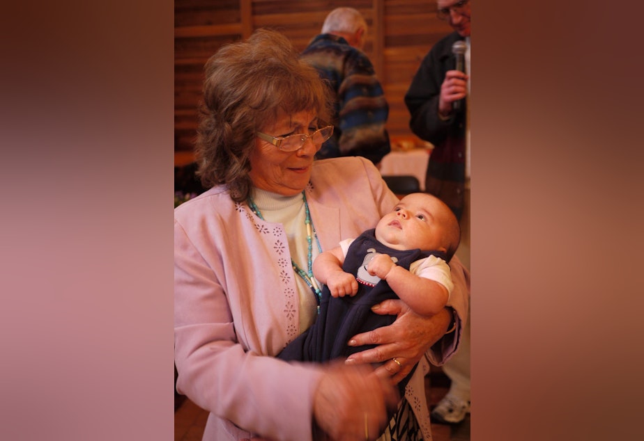 caption: Duwamish chairwoman Cecile Hansen holds her great grandson, Maximus Pearson.