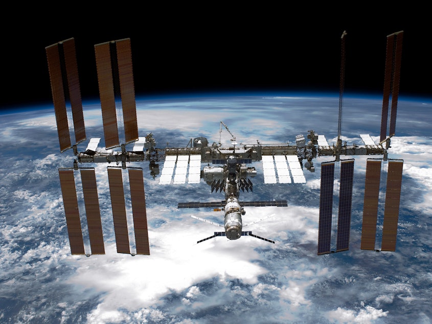 caption: The International Space Station shown in orbit in 2011. Astronauts aboard the station were ordered to briefly take shelter after Russia conducted an orbital test of an anti-satellite missile that spewed potentially dangerous debris into orbit.