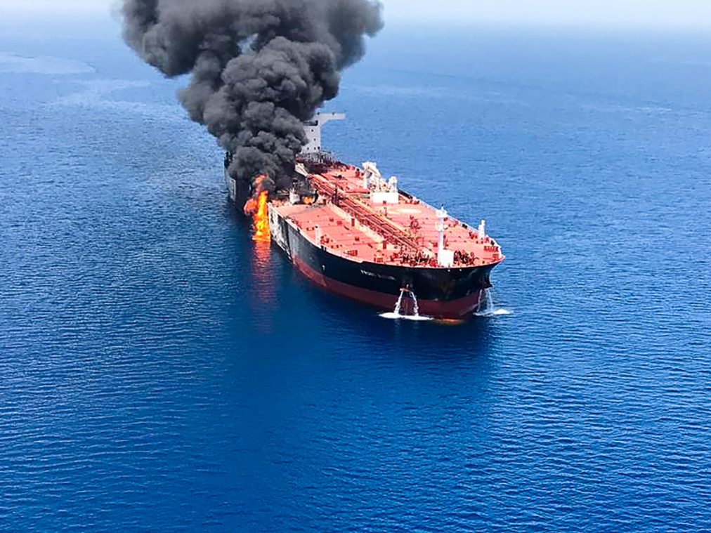 caption: A picture obtained from  Iranian News Agency ISNA on Thursday shows fire and smoke billowing from Norwegian-owned Front Altair tanker said to have been attacked in the waters of the Gulf of Oman.