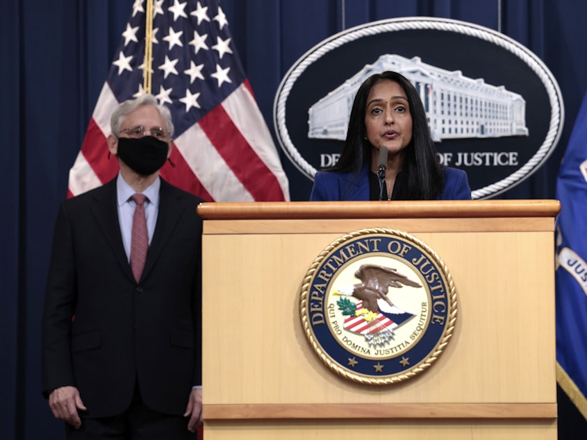caption: Associate Attorney General Vanita Gupta, joined by Attorney General Merrick Garland, announces that the Justice Department was suing Texas over its recent redistricting map.