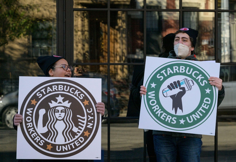 caption: Starbucks workers strike outside a Starbucks coffee shop on Nov. 17, 2022, in Brooklyn, protesting the company's anti-union activities.
