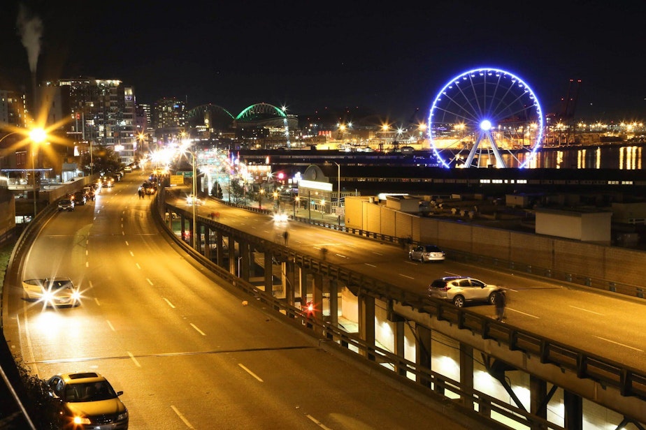 caption: Cars pulled to the side of the viaduct on its final night. Note the bright lights coming from the back of the northbound lane — those cars don't want to inch forward, because they want to be the last car to drive the viaduct.