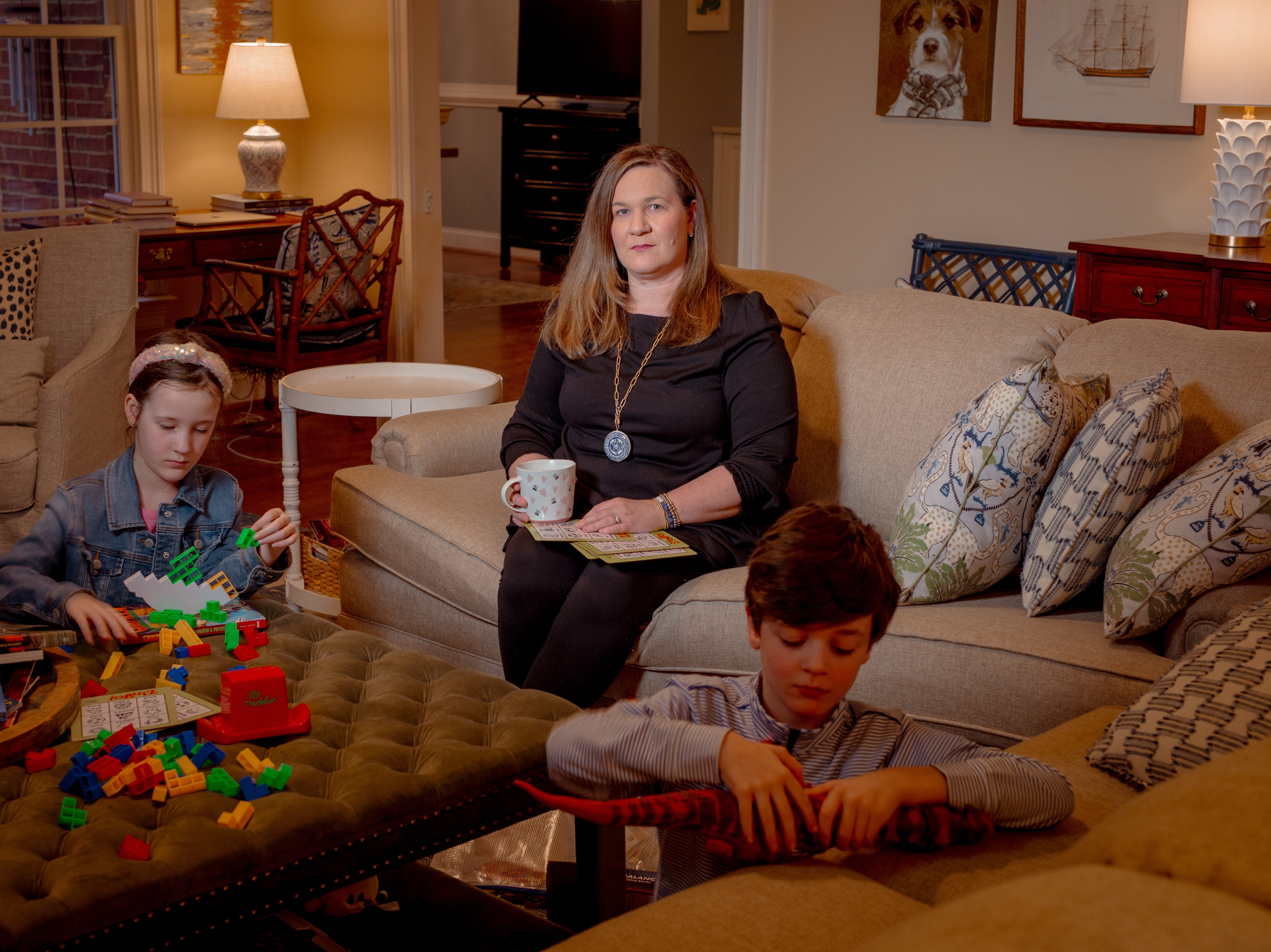 caption: Kate Morrow and her 8-year-old twins, Jack and Lilly, at their home in Spartanburg County, S.C.  Morrow struggles to understand why many of her neighbors haven't vaccinated their kids.