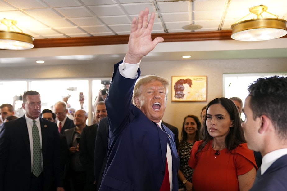 caption: Former President Donald Trump waves to supporters at Versailles restaurant on Tuesday, June 13, 2023, in Miami. Trump appeared in federal court Tuesday on dozens of felony charges accusing him of illegally hoarding classified documents and thwarting the Justice Department's efforts to get the records back.