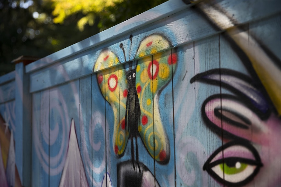 caption: A portion of a mural by Ryan Henry Ward is shown on Wednesday, September 8, 2021, in the backyard of a home in Shoreline.