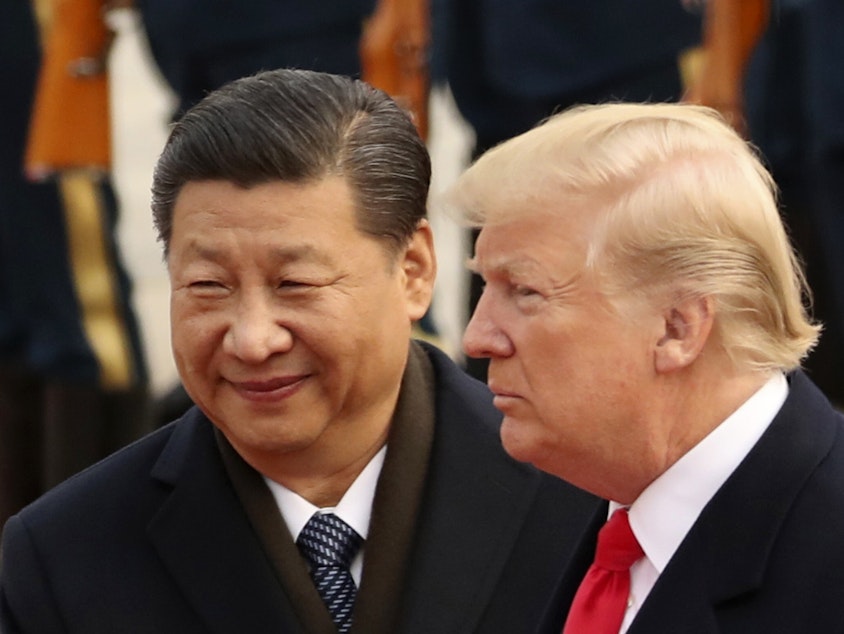 caption: President Donald Trump and Chinese President Xi Jinping participate in a welcome ceremony at the Great Hall of the People in Beijing, China, in November of last year.