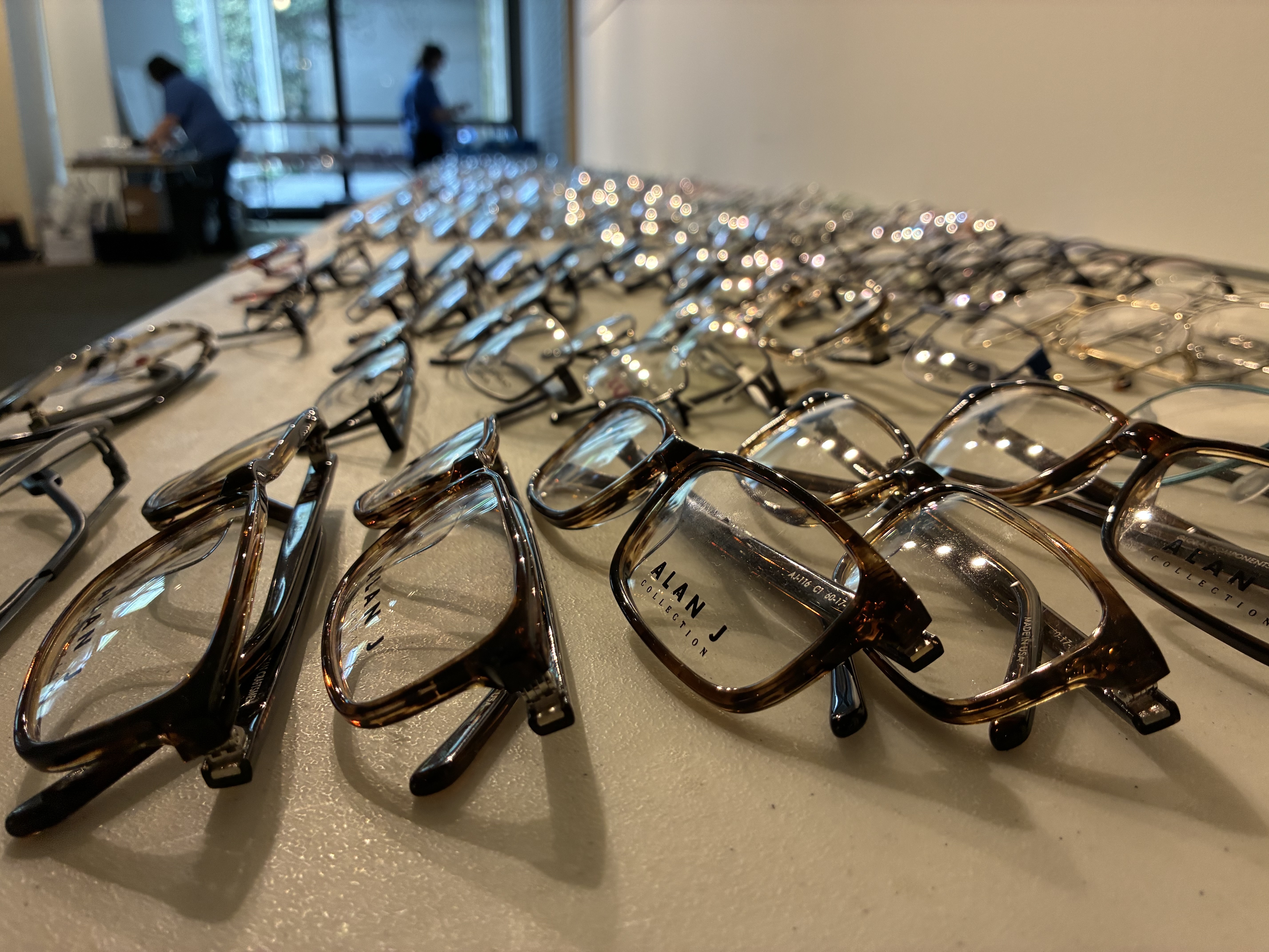 caption: Rows of free eyeglass frames at the vision care section of the Seattle/King County Clinic, April 23, 2026. 
