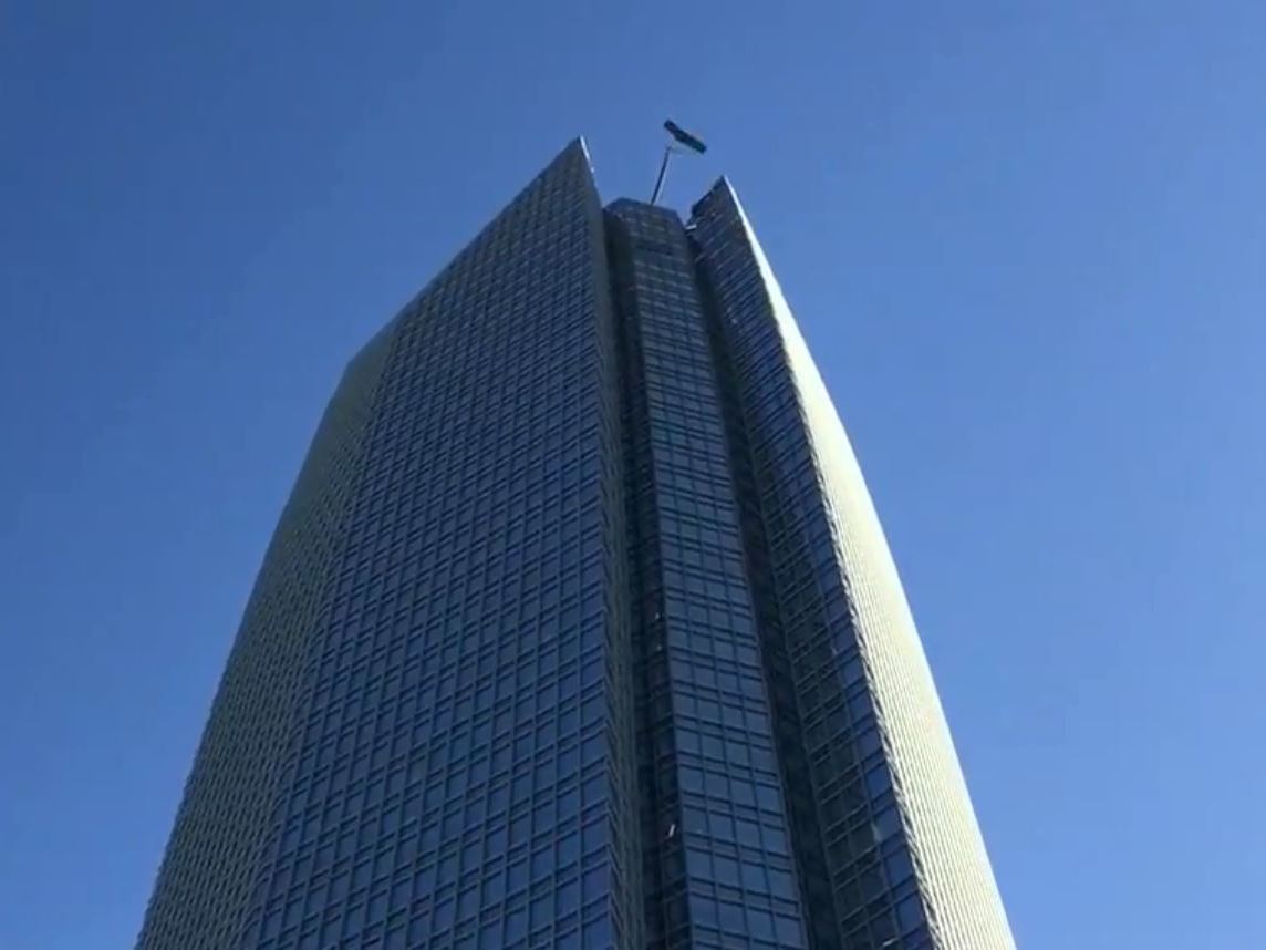caption: Firefighters have rescued two window washers trapped on the Devon Tower in Oklahoma City.