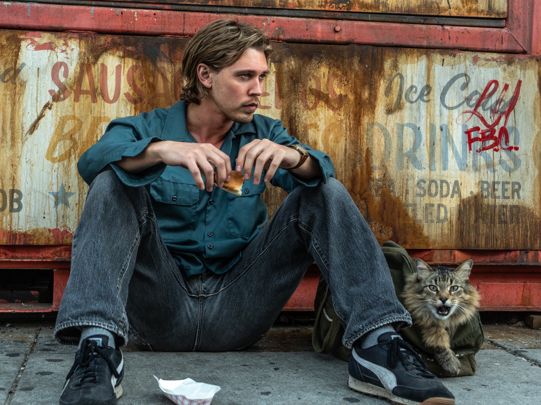 caption: In <em>Caught Stealing</em>, Austin Butler plays a man whose life is upended when he agrees to look after his neighbor's cat.