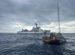 caption: The U.S. Coast Guard Cutter Active rescued a German sailor from his wooden sailboat off Ecuador's Galapagos Islands on April 13, 2024.