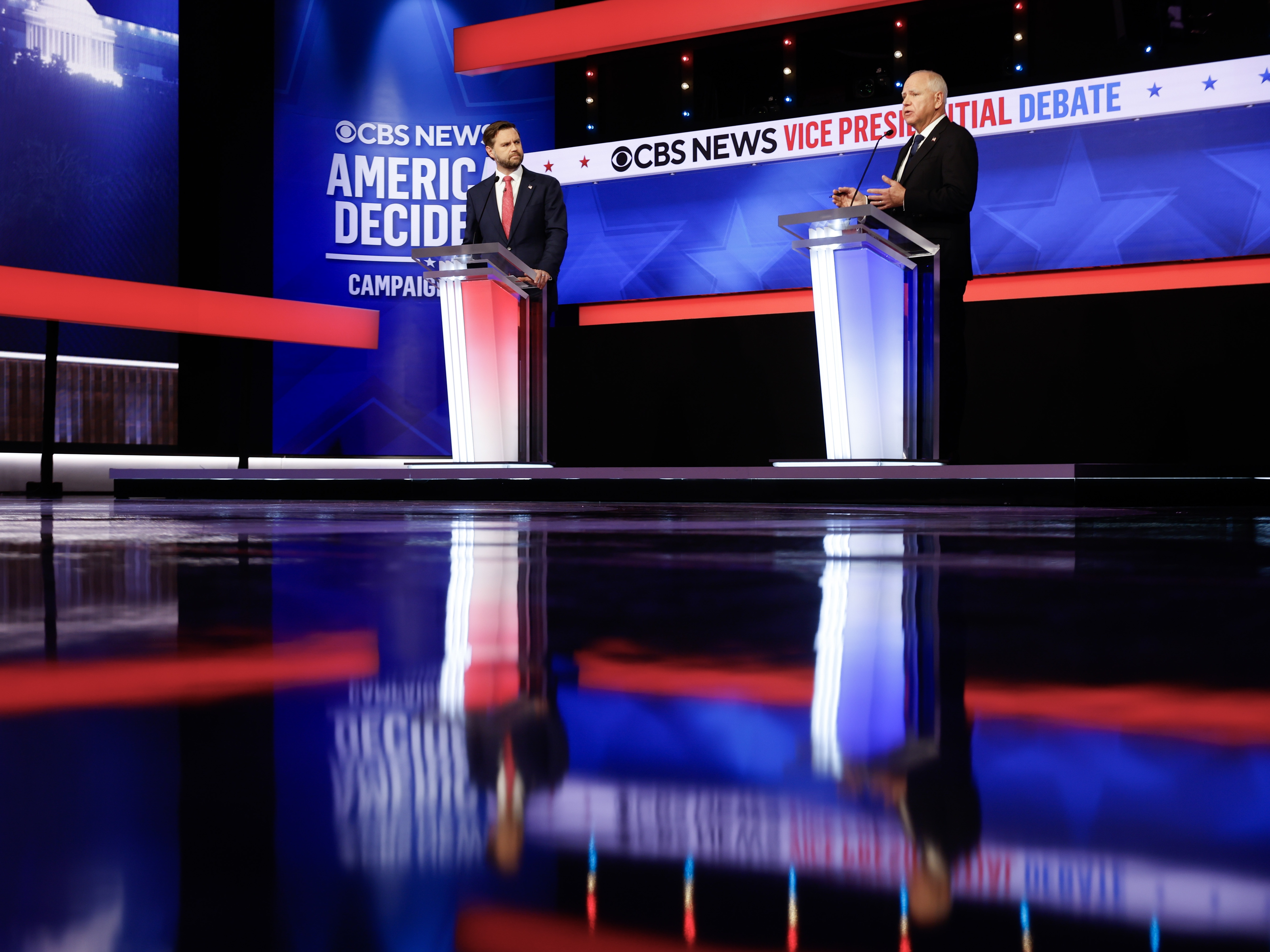 caption: Republican vice presidential candidate, Sen. JD Vance, and Democratic vice presidential candidate, Minnesota Gov. Tim Walz, participate in a debate at the CBS Broadcast Center on Oct. 1, 2024 in New York City.