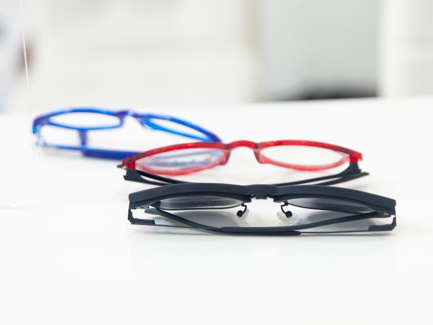 caption: Reading glasses are easy to come by in Western countries. But getting a pair in the Global South can be a challenge. A new study shows the surprising benefits that a pair of specs can bring.