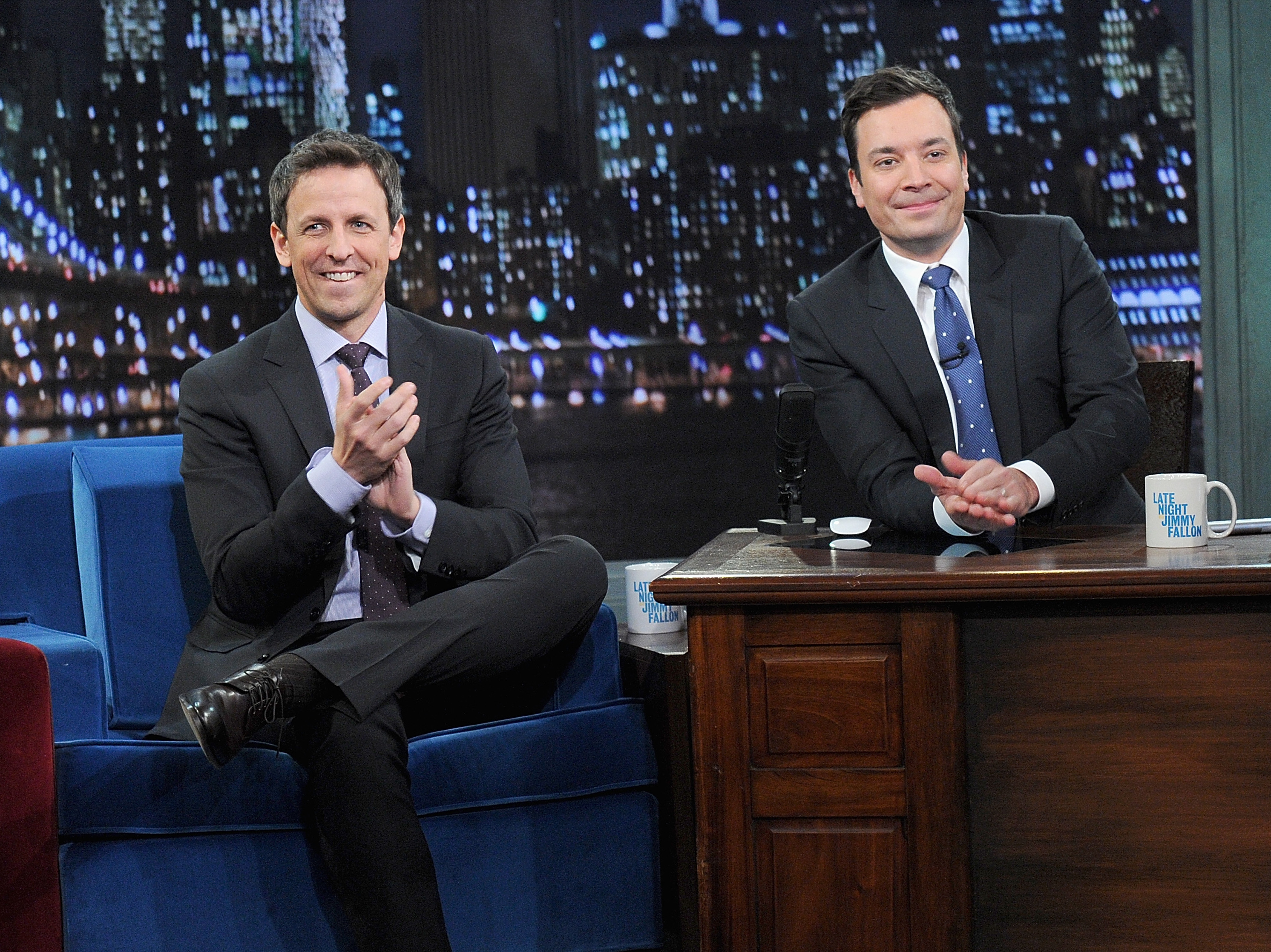 caption: Seth Meyers and host Jimmy Fallon appear on <em>Late Night With Jimmy Fallon</em> on Jan. 28, 2014, in New York City.